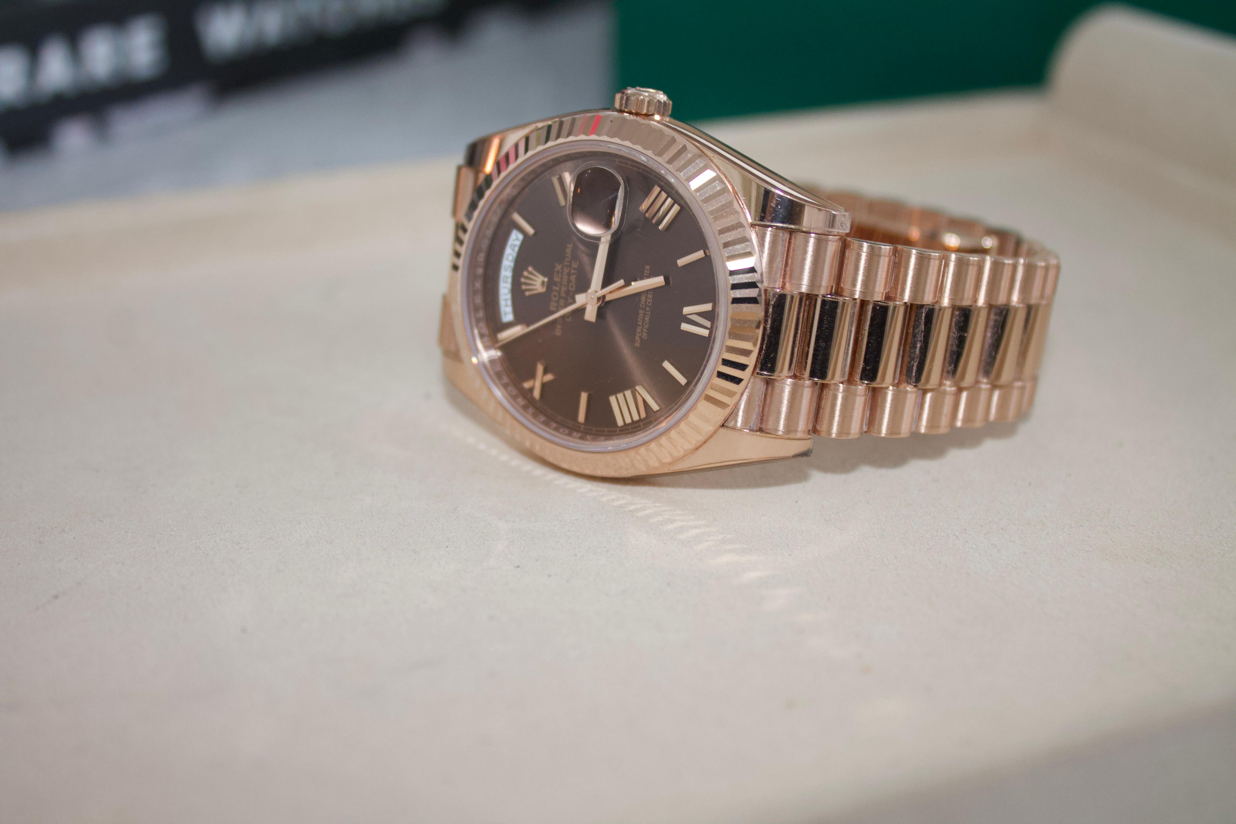 Rolex Daydate 40 ' Presidential " Rose gold Chocolate roman dial